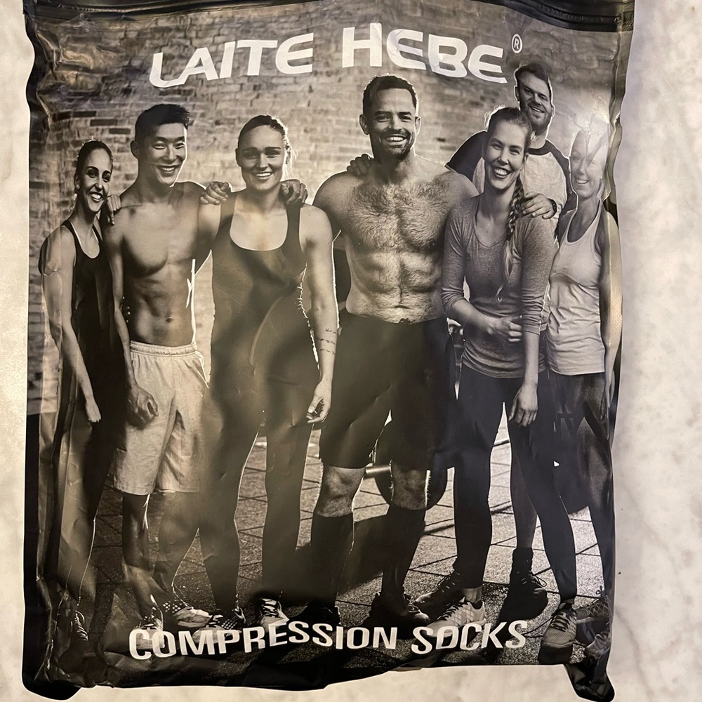NEW Compression Socks.  5 pairs.   3 Nude and 2 black.